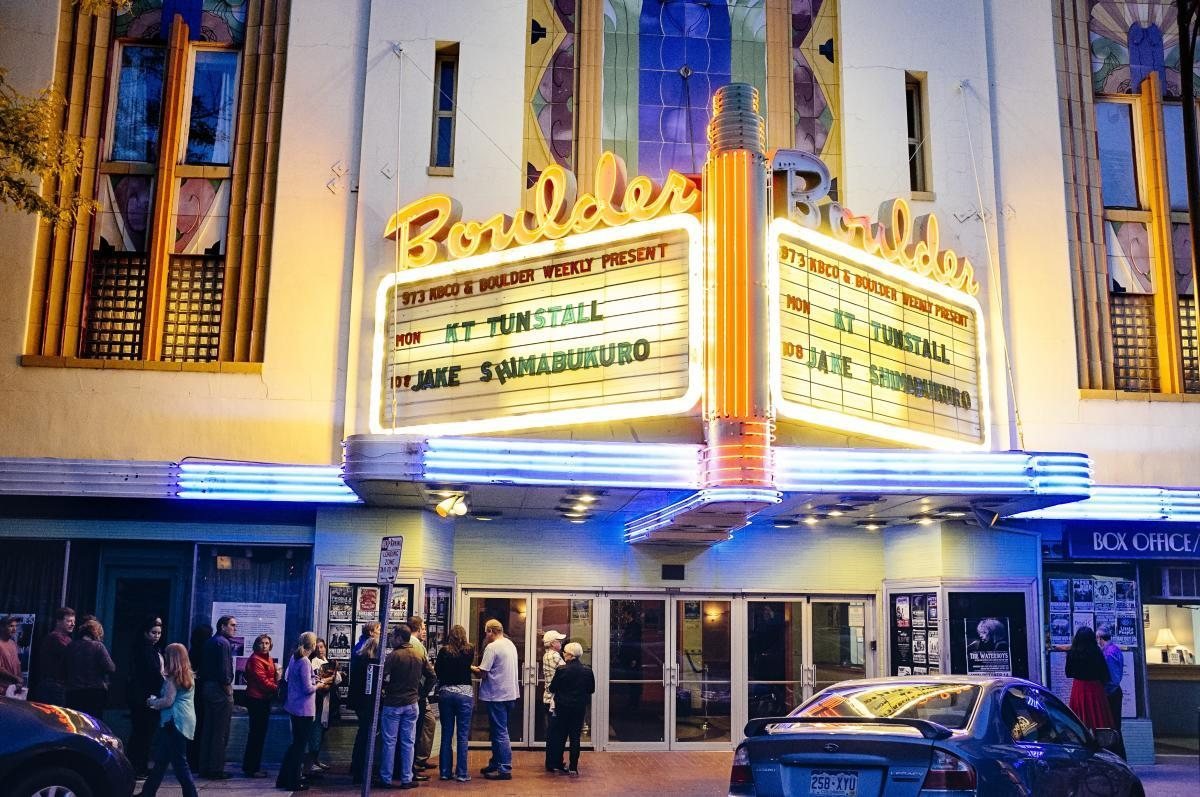 Boulder Theater marquee lit up at night in downtown Boulder